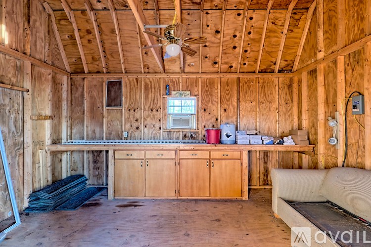 A room under construction with wooden walls and ceiling.