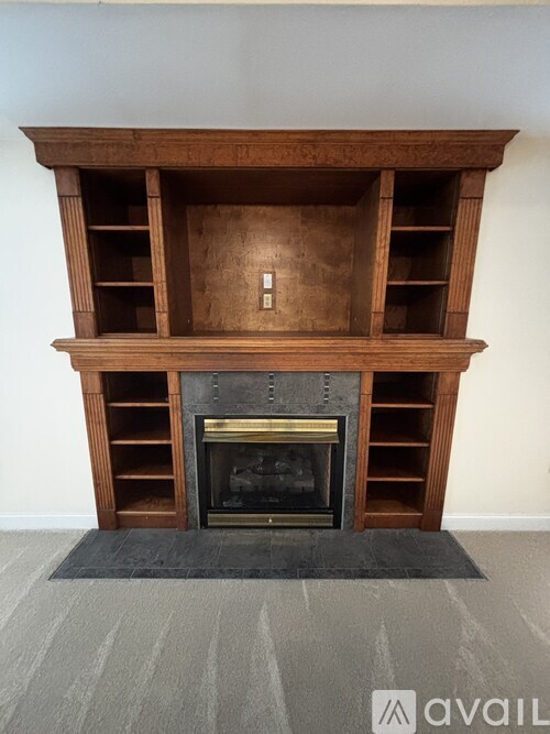 A fireplace with a fire burning inside.