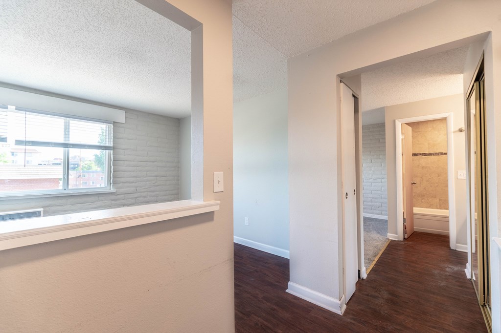 A room with a window and a door.