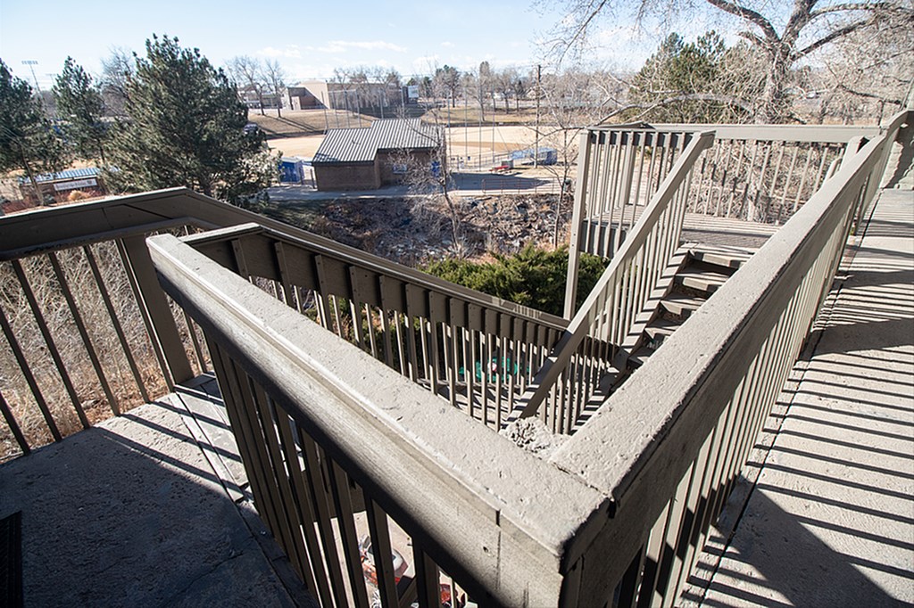 A concrete staircase with metal railing.