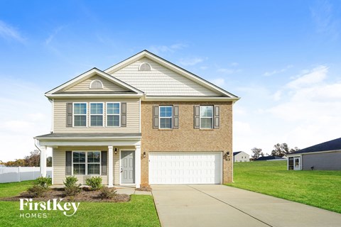 A house with a garage is for sale by FirstKey Homes.