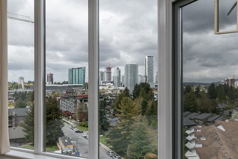 A view of a cityscape through a window.