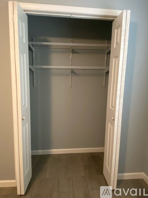 A white pantry door is open.