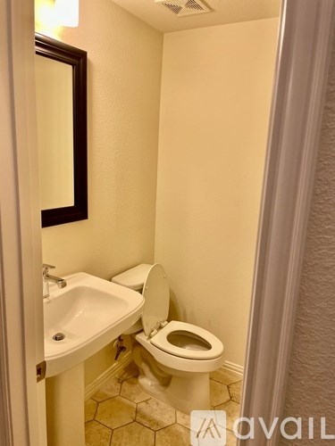 A small bathroom with a toilet and sink.