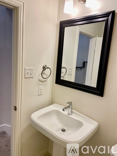A bathroom sink with a mirror above it.