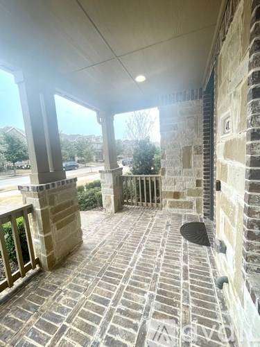 A stone walkway leads to a building entrance.