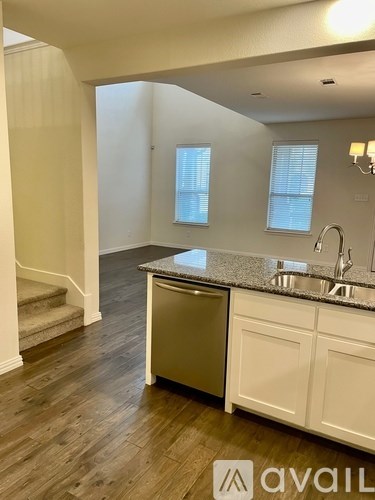 A kitchen with a dishwasher and sink.