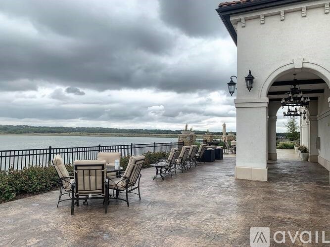 A patio with chairs and a table is available for rent.