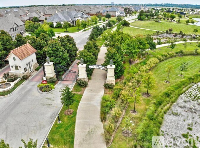 A residential area with a road and houses.