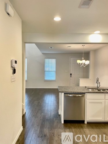 A kitchen with a dishwasher and a sink.