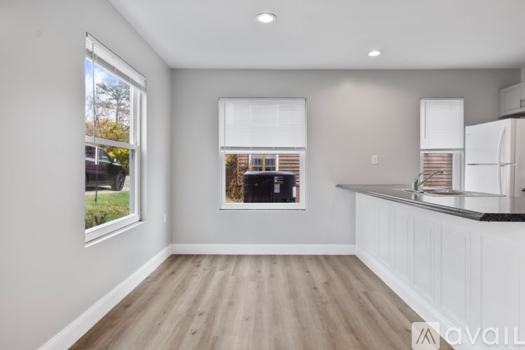 A kitchen with a window and a counter.