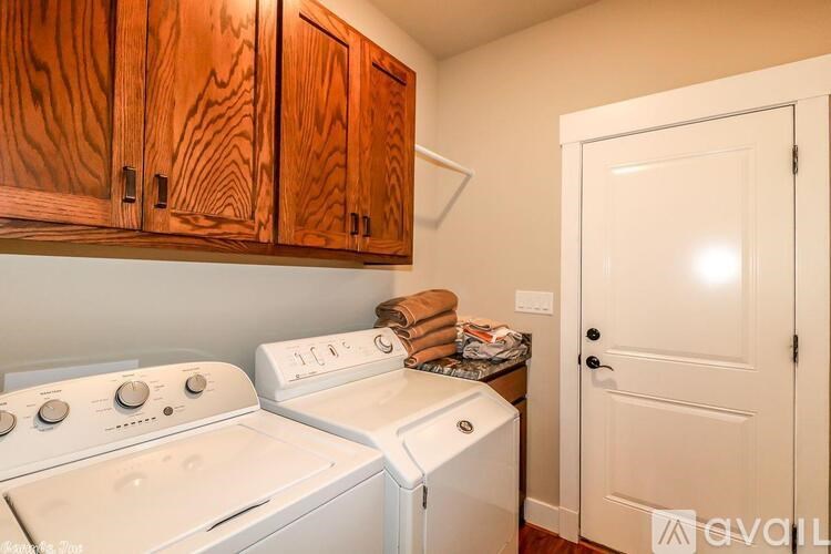 A small laundry room with a washer and dryer.