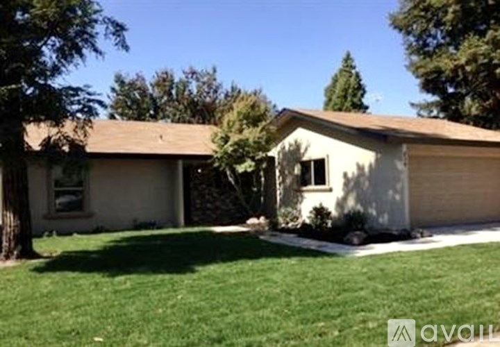 A house with a brown roof and a white garage door.