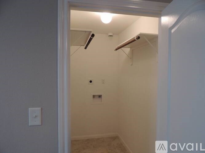 A small, empty room with a light on.