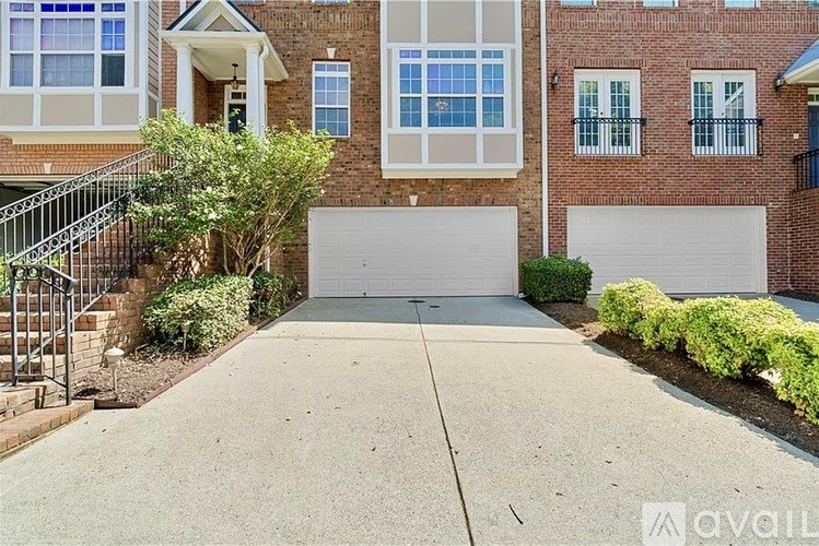 A house with a garage and a driveway.