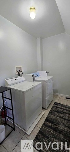 A bathroom with two sinks and a mirror.
