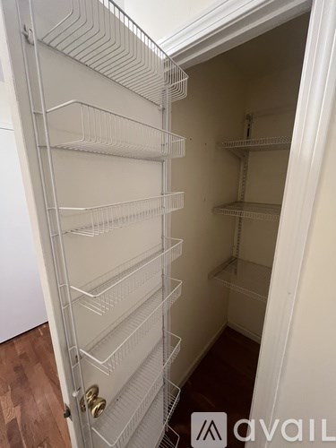 A white refrigerator with many shelves is shown.
