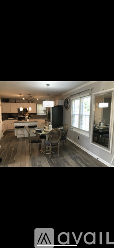 A dining area with a table set for four.