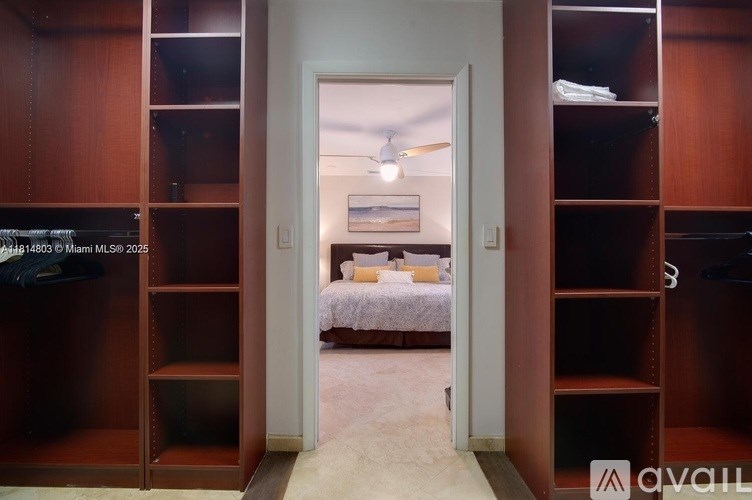 A room with a bed and a wooden shelving unit.