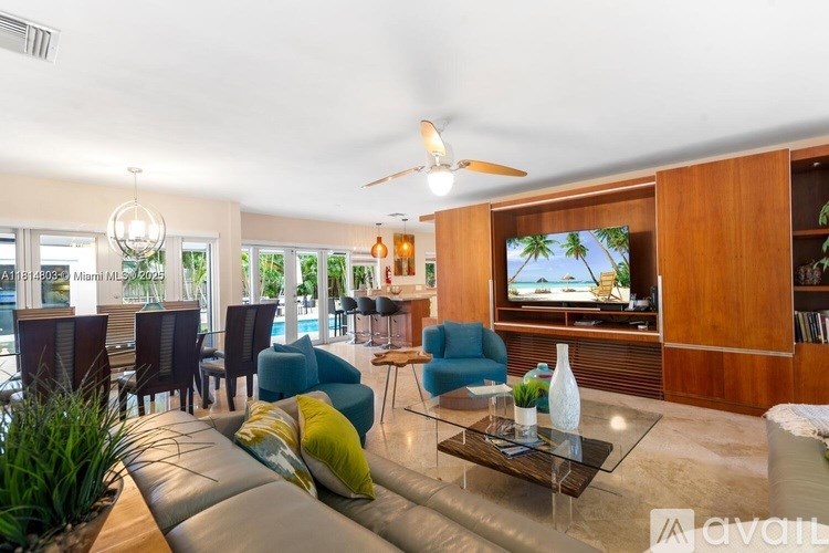 A living room with a television and a couch.