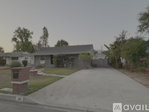 A house with a driveway and a mailbox is visible.