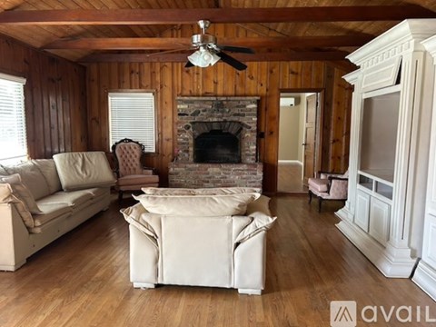 A living room with a fireplace and a couch.