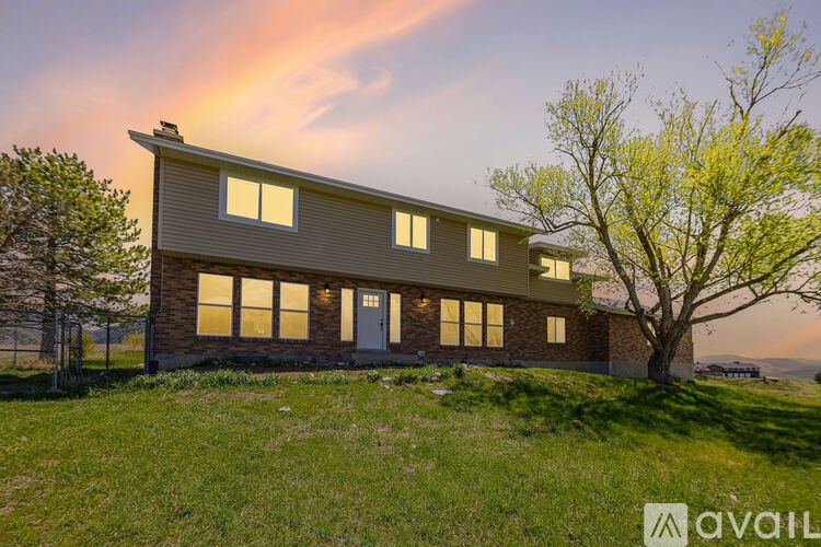 A house with a tree in front of it.