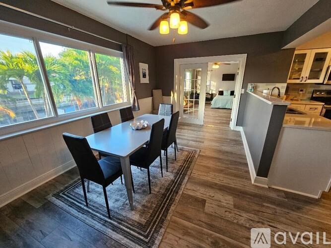 A dining room with a table and chairs is shown.