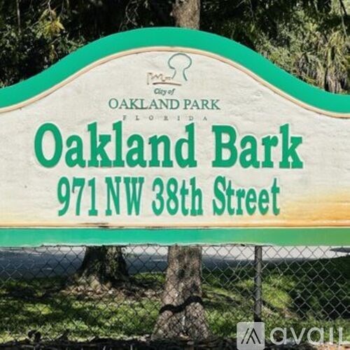 A beach scene with palm trees and a lifeguard tower under a vibrant sky.