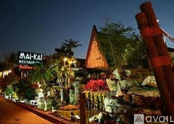 A restaurant named Mai-Kai is lit up at night.