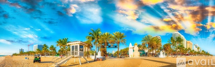 A beach scene with palm trees and a lifeguard tower under a vibrant sky.