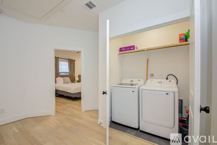 A room with a washer and dryer in it.