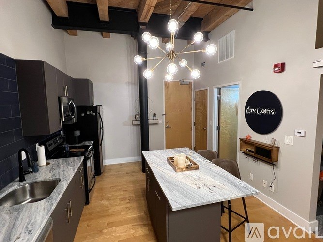 A kitchen with a table and chairs in the middle of the room.
