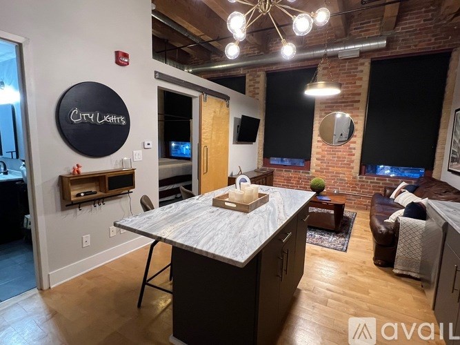 A modern kitchen with a large island in the middle.