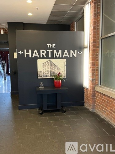 A wall with a sign that says The Hartman.
