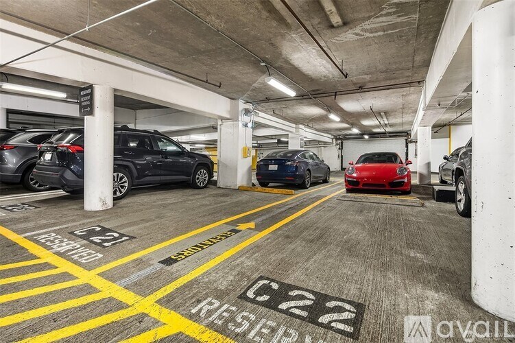 A parking garage with a red car parked in spot C22.