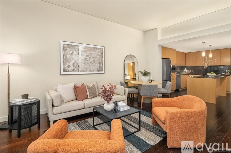 A living room with a couch, armchair, and coffee table.