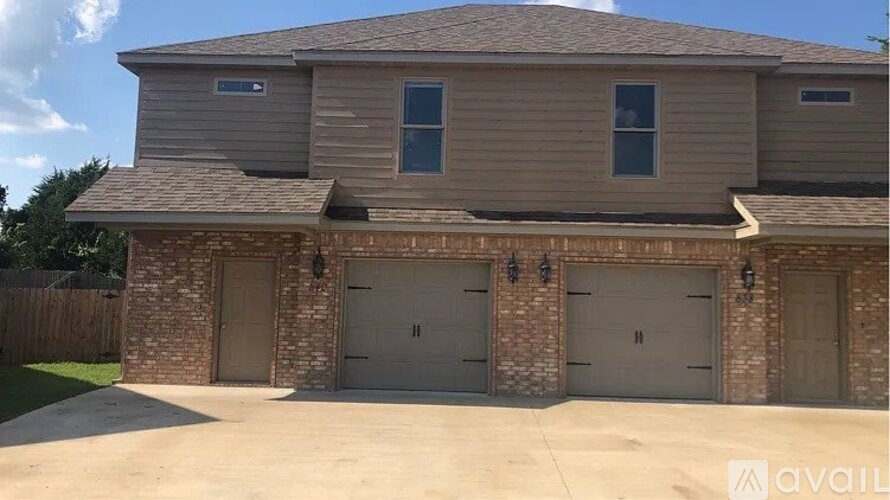 A house with a garage and a driveway.