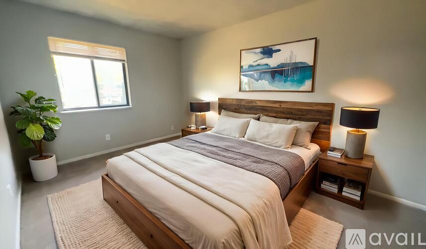 A room with a carpeted floor and a window.