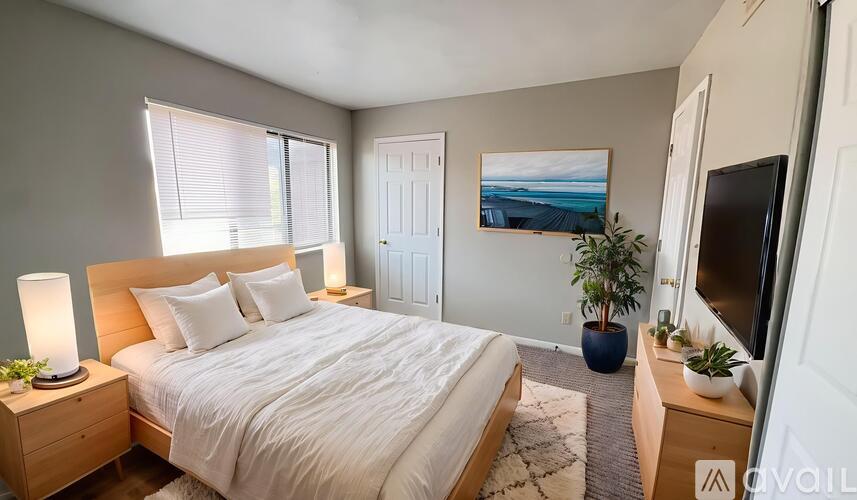 A room with a carpeted floor and a window.