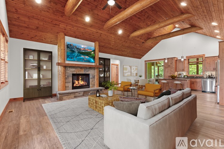 A living room with a fireplace and a couch.