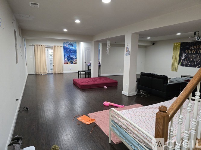 A room with a staircase and a couch.