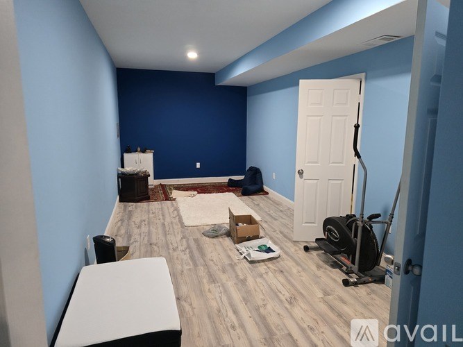 A room with blue walls and a white door.