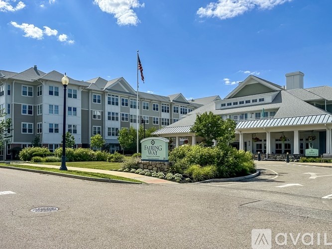 A large building with a flag on top and a sign that says "Fairway".