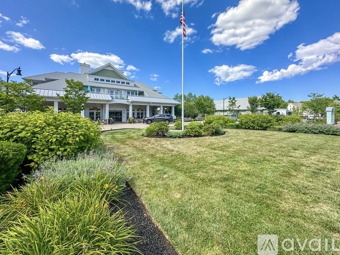 A building with a flag on a pole in front of it.