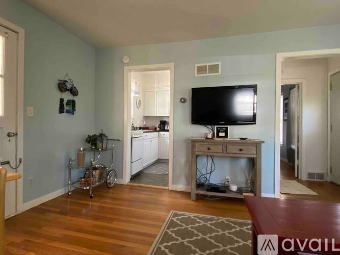 A living room with a television and a bicycle.