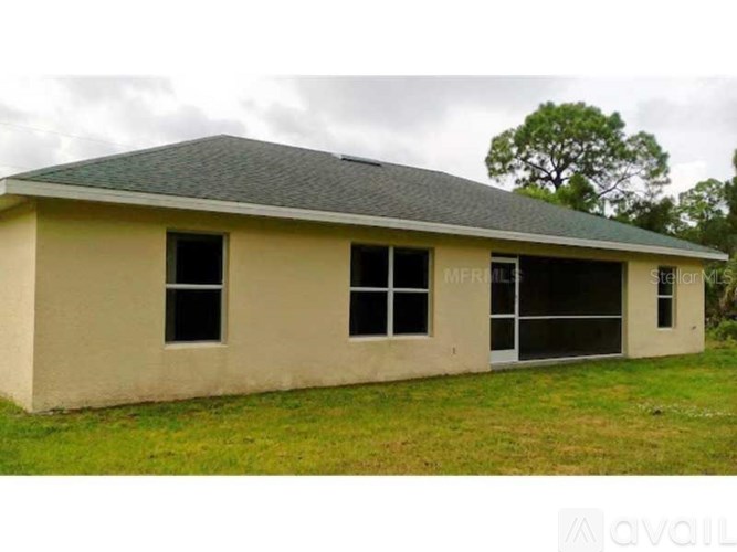 A two-story house with a garage is available for purchase.