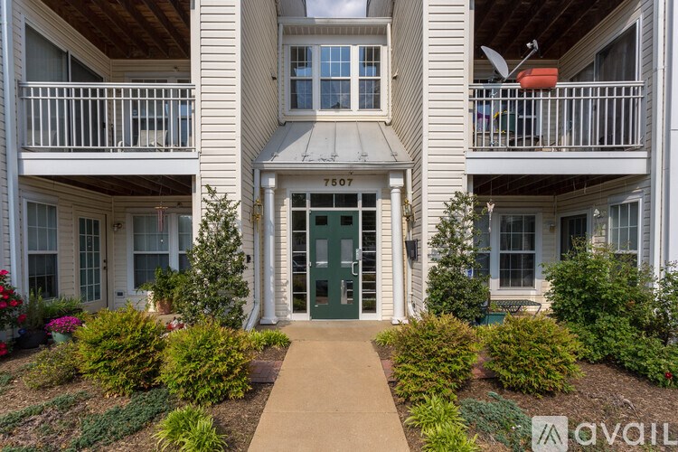 The image shows a building with the number 7507 on it.