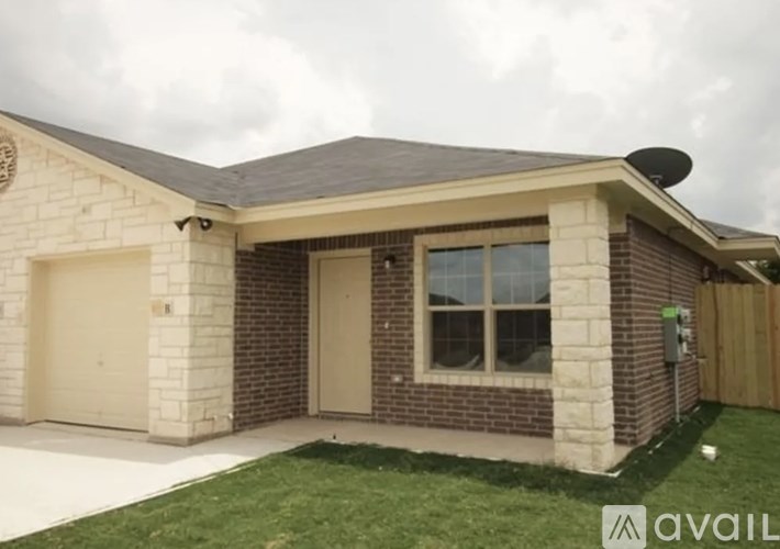 A house with a garage and a driveway.