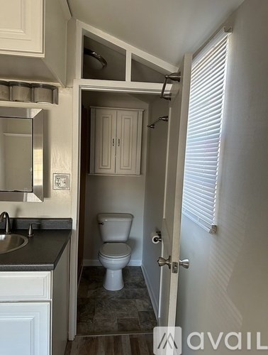 A small bathroom with a toilet and sink.